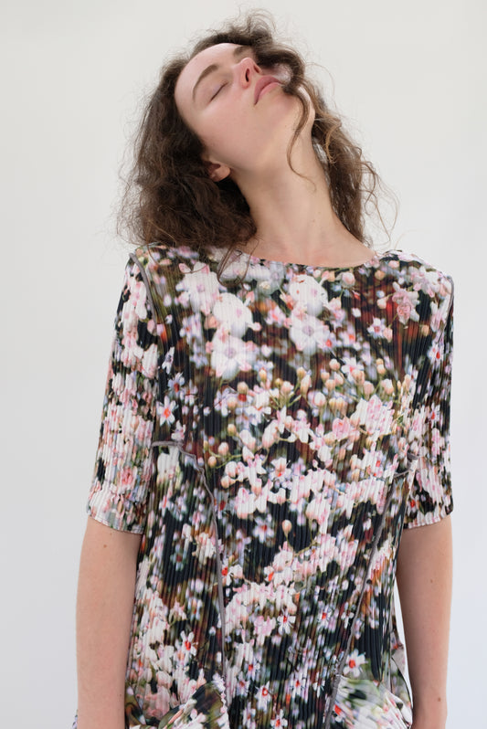 Beklina Woman wearing a floral dress against a white background. Julia Heuer Uma Dress Holle