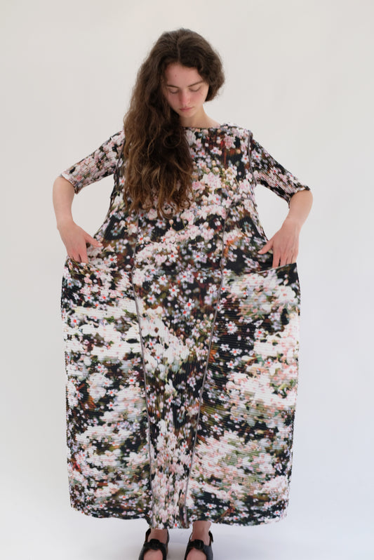 Beklina Woman wearing a floral dress against a white background. Julia Heuer Uma Dress Holle