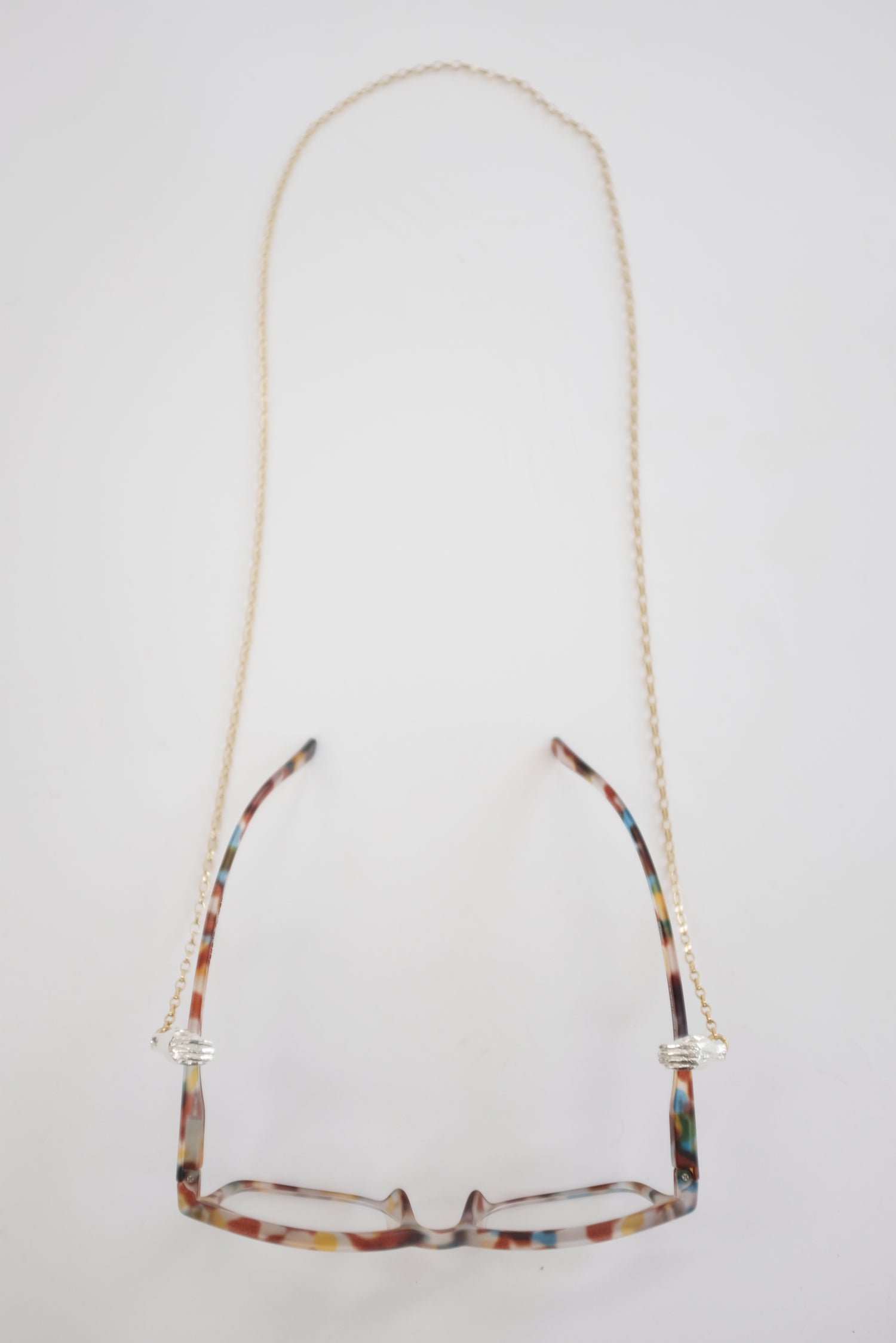 Beatriz Palacios Holding Hands Eyewear Chain